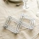 Dessous de plat pliant en inox sur nappe en lin